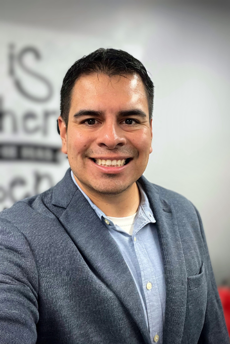 Jesse Vera a man standing on top of a pile of snow