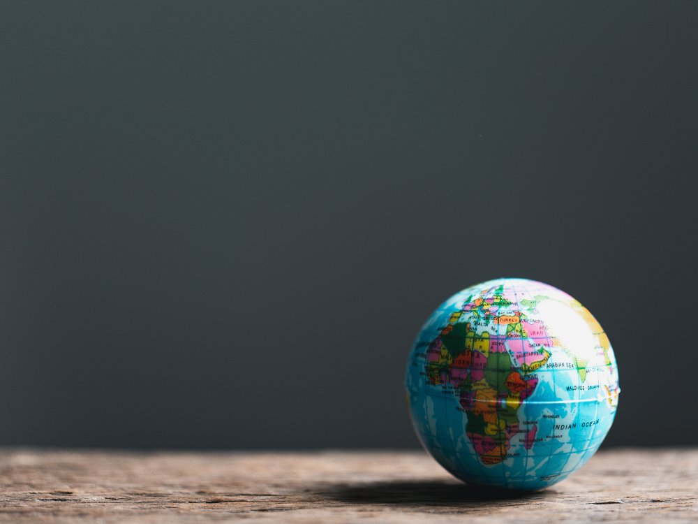 woman beside white vehicle during daytime